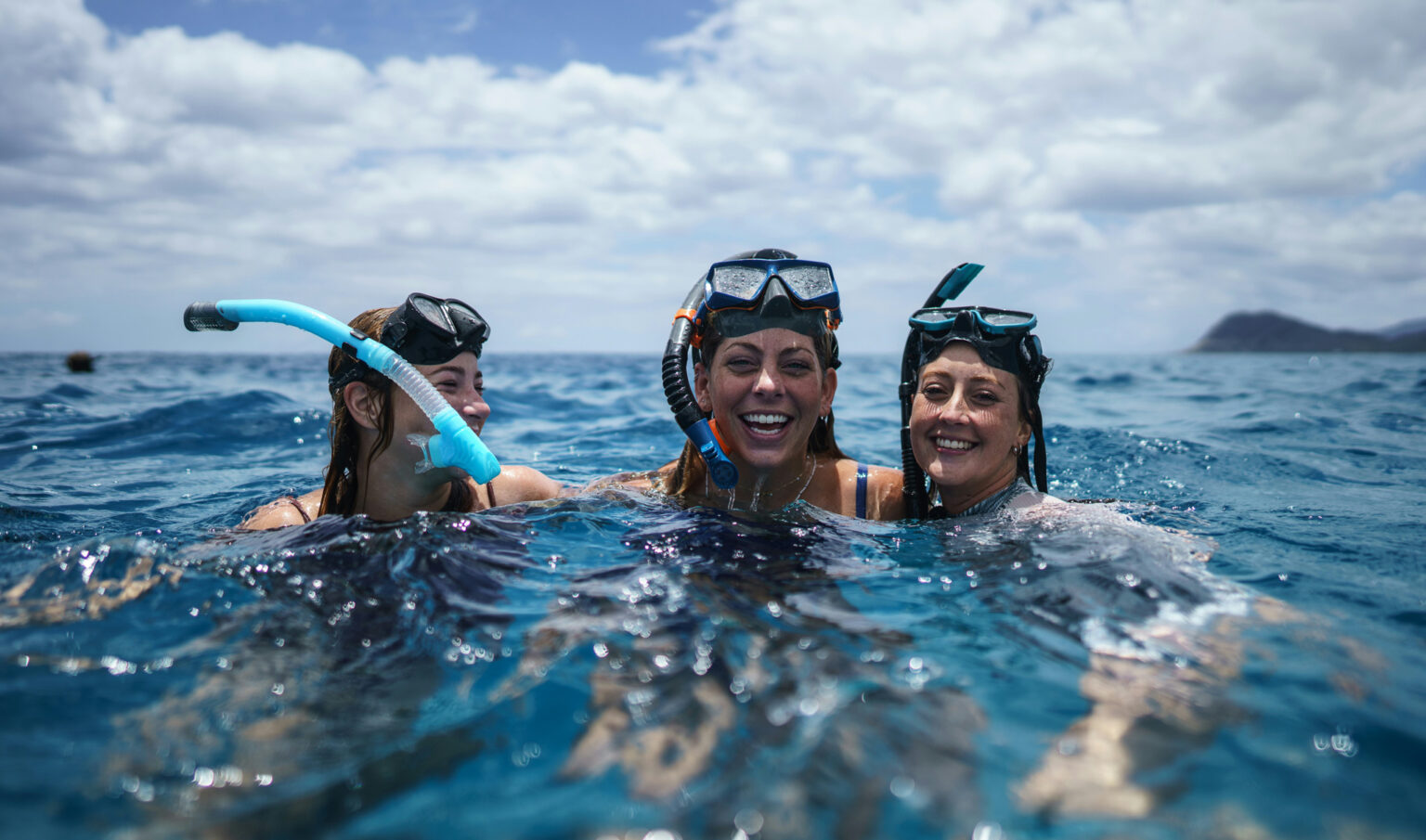 Three women snorkeling in Puerto Escondido